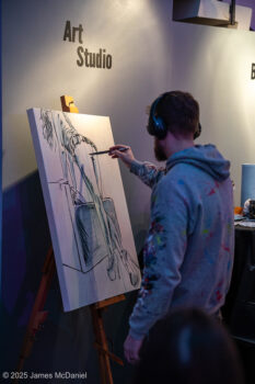 artist painting at SEAF 2025